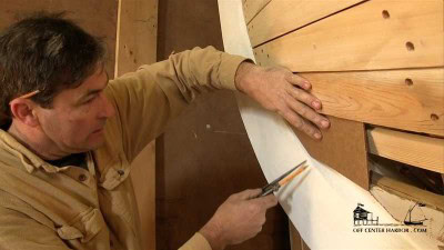 Spiling, the technique boat builders use to determine the shape of a plank, is demonstrated by an experienced boatbuilder