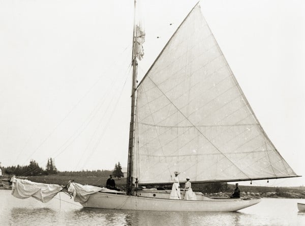 Penobscot Marine Museum Photo - two Ladies pose on a classic sailboat. LB2013.21.271