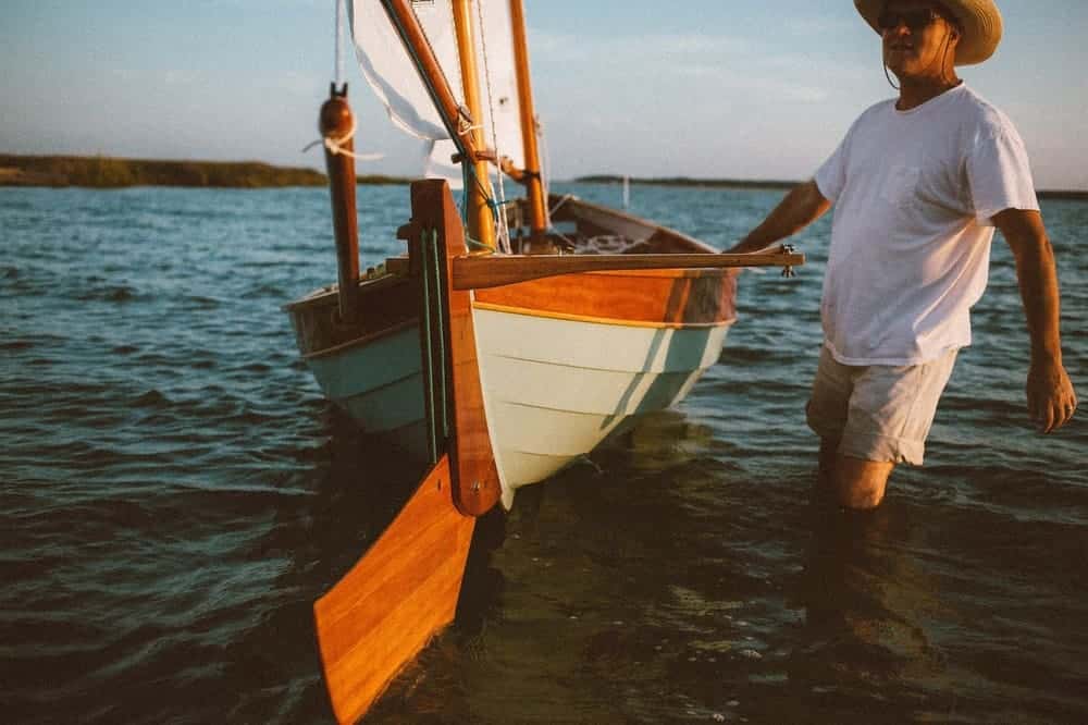 Through her words and beautiful photographs, Leney Breeden brings us along a camp-cruising adventure aboard UNA, a Sooty Tern, built and sailed by her father.