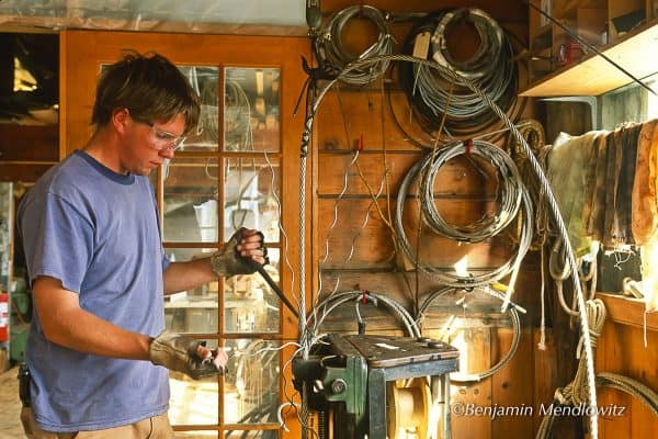 Shipyard Apprentice - Hard at work in the shop, Myles splices wire rope. Although not quite so strong as mechanical terminals, the traditional splices are more flexible and long-lived.